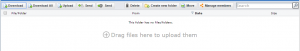 The file listing of an empty folder, below the toolbar, carrying the hint “Drag files here to upload them” in the middle of the listing area.