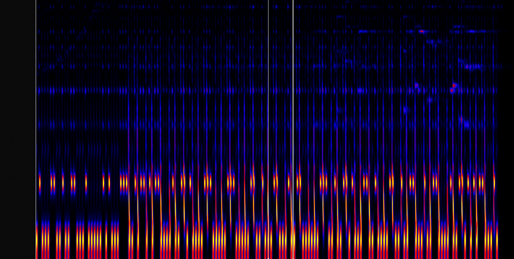 The melodic range spectrogram, showing a pattern of high and low reddish bars.